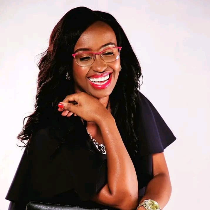 Monica Chege laughing candidly during a studio portrait session