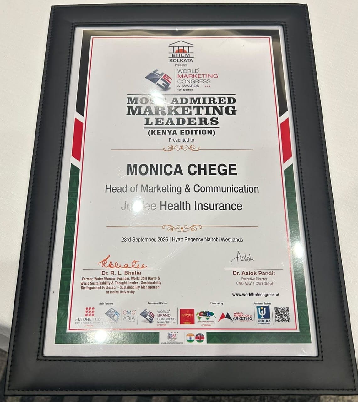 Framed certificate reading Most Admired Marketing Leaders, Kenya Edition, presented to Monica Chege, Head of Marketing & Communication, Jubilee Health Insurance, dated 23 September 2026